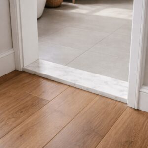 Bathroom door marble threshold installed at bathroom entrance